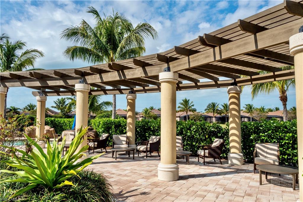 9834 Giaveno Circle, Unit 1746 Naples, FL 34113 - Photo 29 of 41 a view of outdoor space yard and porch