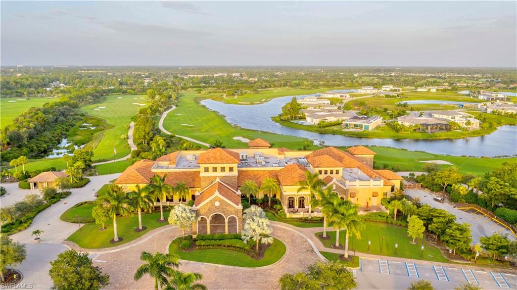 9834 Giaveno Circle, Unit 1746 Naples, FL 34113 - Photo 36 of 41 an aerial view of residential houses with outdoor space