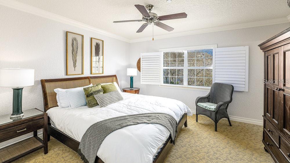 7650 Whisper Way, Unit 304 Reunion, FL 34747 - Photo 12 of 37 a bedroom with a bed and a window