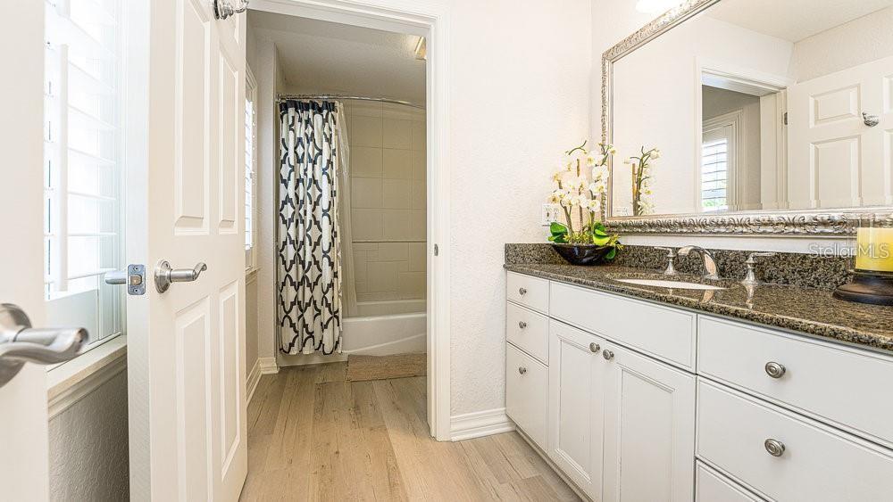 7650 Whisper Way, Unit 304 Reunion, FL 34747 - Photo 14 of 37 a bathroom with a sink and a mirror