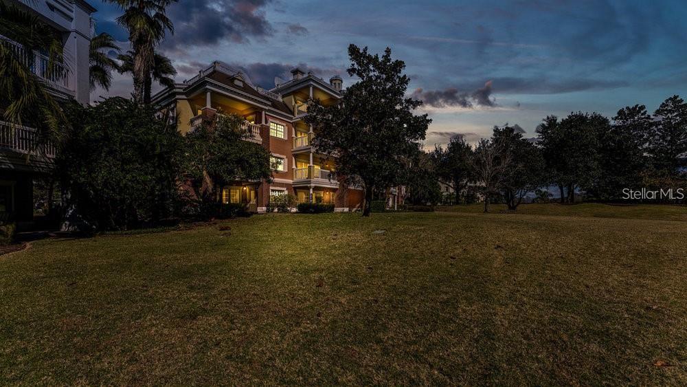 7650 Whisper Way, Unit 304 Reunion, FL 34747 - Photo 31 of 37 a view of outdoor space with garden and trees
