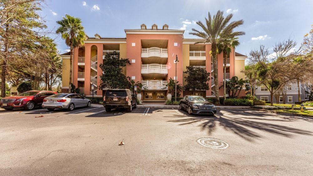 7650 Whisper Way, Unit 304 Reunion, FL 34747 - Photo 33 of 37 a car parked in front of a building
