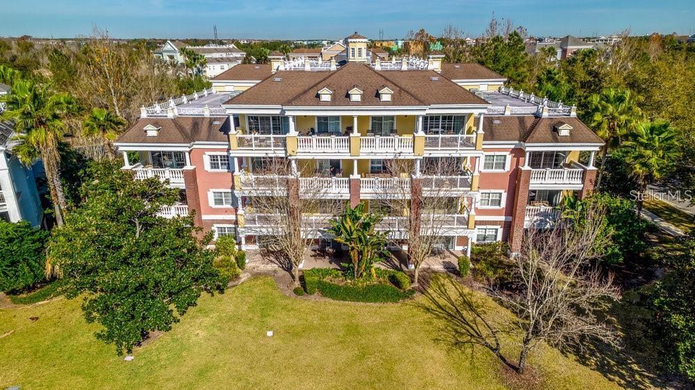7650 Whisper Way, Unit 304 Reunion, FL 34747 - Photo 36 of 37 an aerial view of a house with a swimming pool