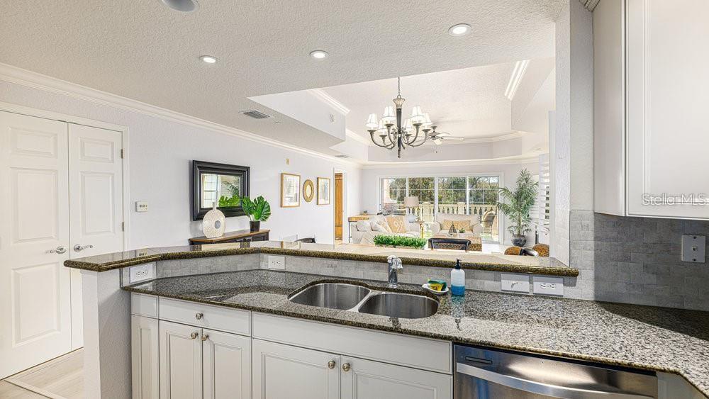 7650 Whisper Way, Unit 304 Reunion, FL 34747 - Photo 7 of 37 a kitchen with a sink and large window