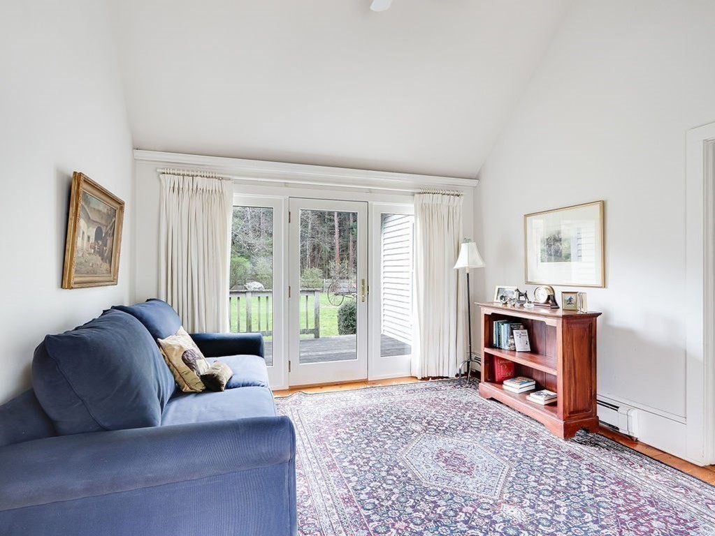 178 Dedham Street Dover, MA 02030 - Photo 16 of 42 a living room with furniture and a flat screen tv