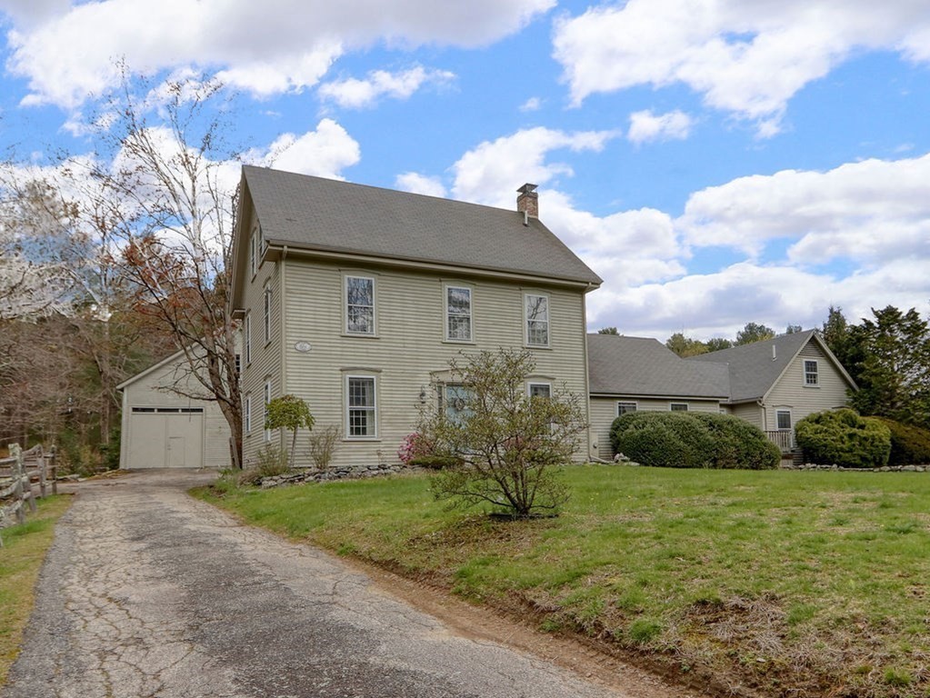 178 Dedham Street Dover, MA 02030 - Photo 2 of 42 a front view of a house with a yard