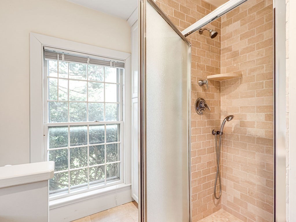 178 Dedham Street Dover, MA 02030 - Photo 21 of 42 a bathroom with a shower and a window