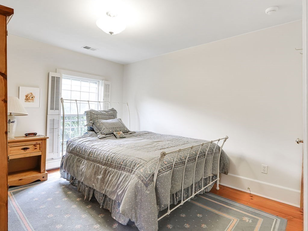 178 Dedham Street Dover, MA 02030 - Photo 22 of 42 a bedroom with a bed and dresser