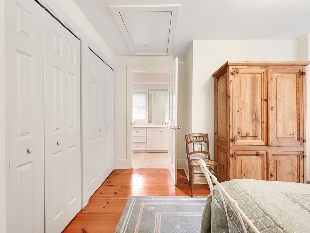 178 Dedham Street Dover, MA 02030 - Photo 23 of 42 a bedroom with a bed and a large window