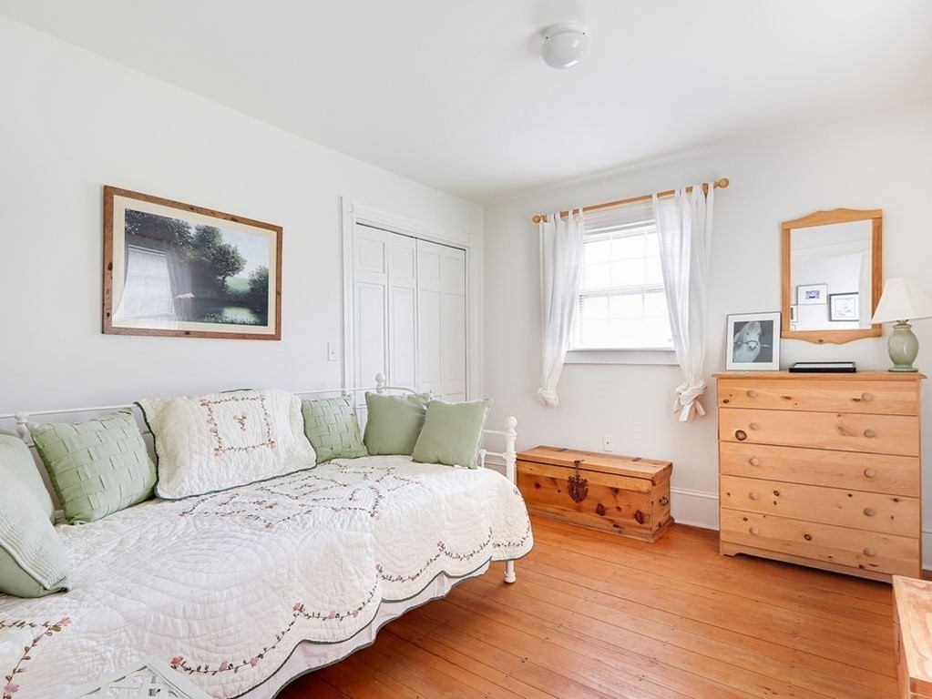 178 Dedham Street Dover, MA 02030 - Photo 27 of 42 a bedroom with a bed and a dresser