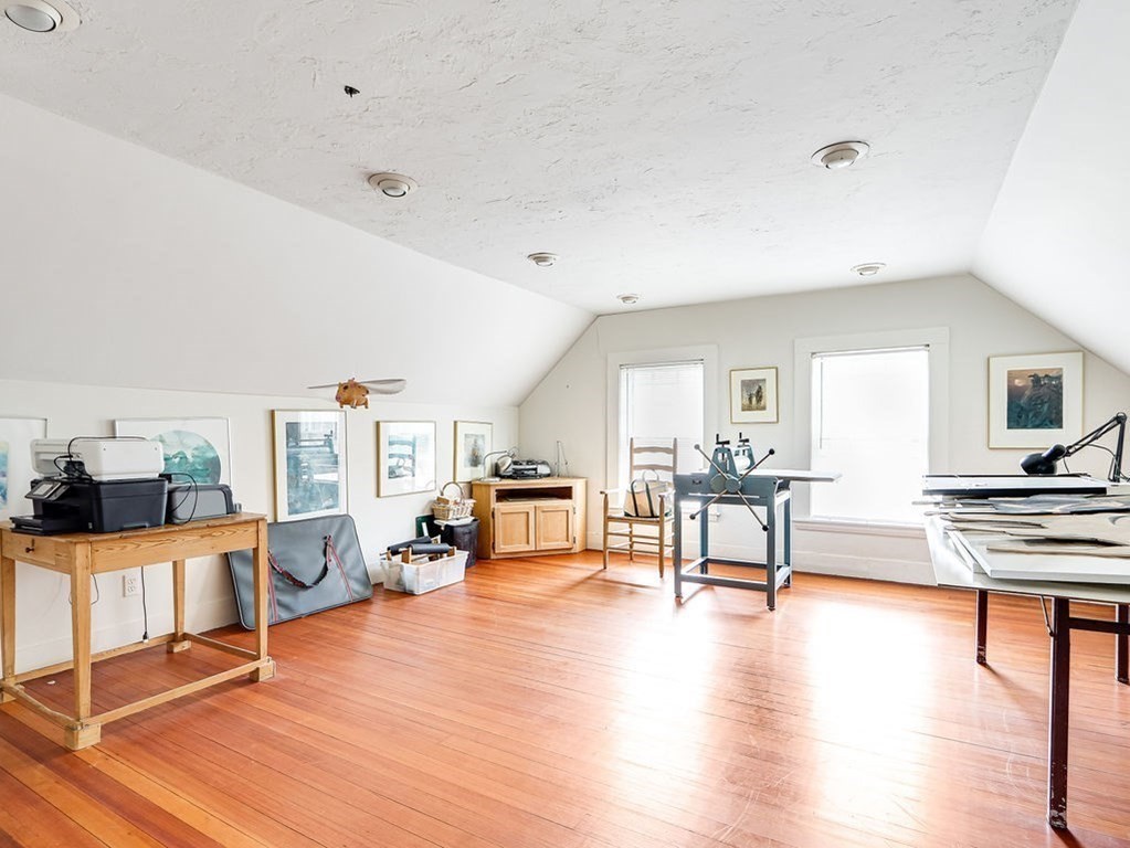 178 Dedham Street Dover, MA 02030 - Photo 30 of 42 a living room with fireplace furniture and a wooden floor
