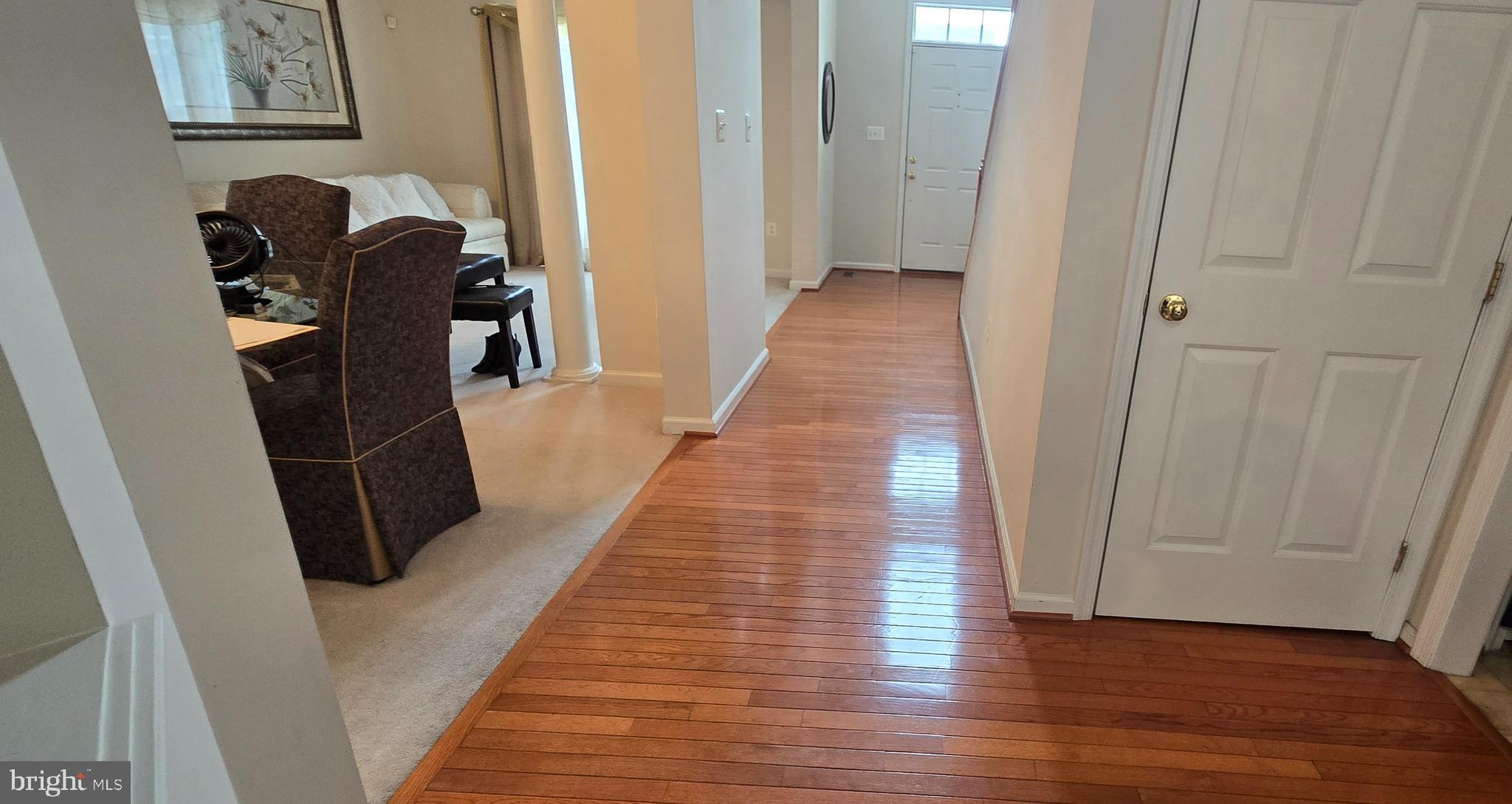 13005 Firestone Court Silver Spring, MD 20904 - Photo 15 of 47 a hallway view with wooden floor and staircase