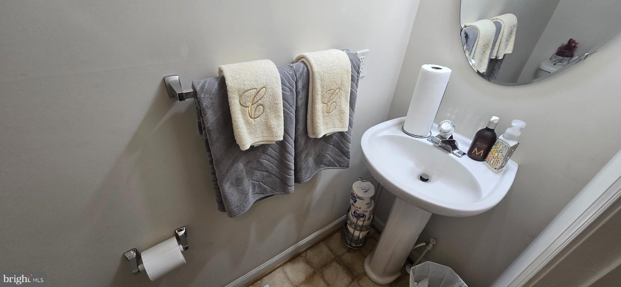 13005 Firestone Court Silver Spring, MD 20904 - Photo 16 of 47 a bathroom with a sink mirror and vanity