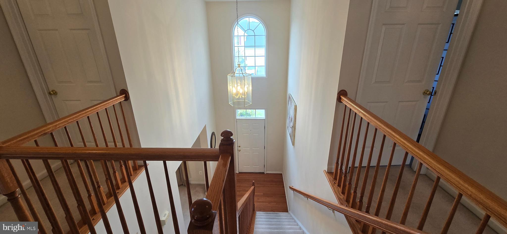 13005 Firestone Court Silver Spring, MD 20904 - Photo 21 of 47 a view of a hallway with wooden floor and stairs