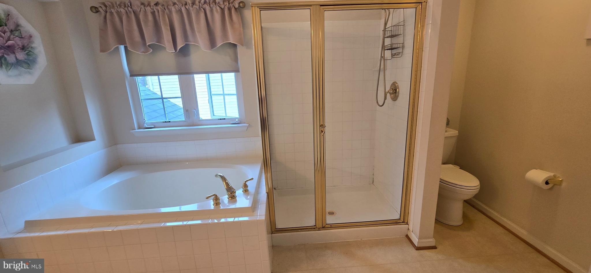 13005 Firestone Court Silver Spring, MD 20904 - Photo 26 of 47 a bathroom with a tub and a shower