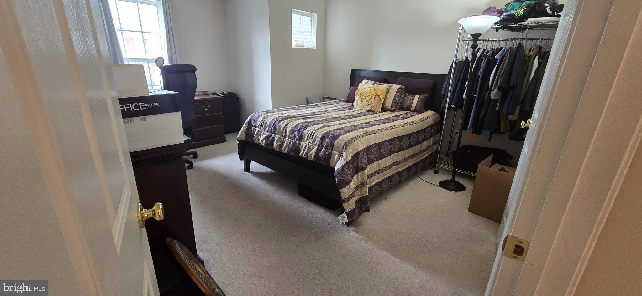 13005 Firestone Court Silver Spring, MD 20904 - Photo 37 of 47 a bedroom with a bed and a walk in closet