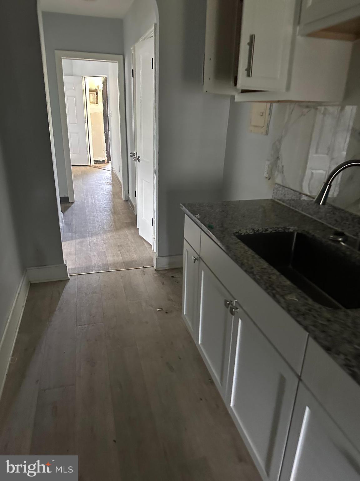 248 Hamilton Street Northwest Washington, DC 20011 - Photo 6 of 6 a kitchen with a sink and refrigerator