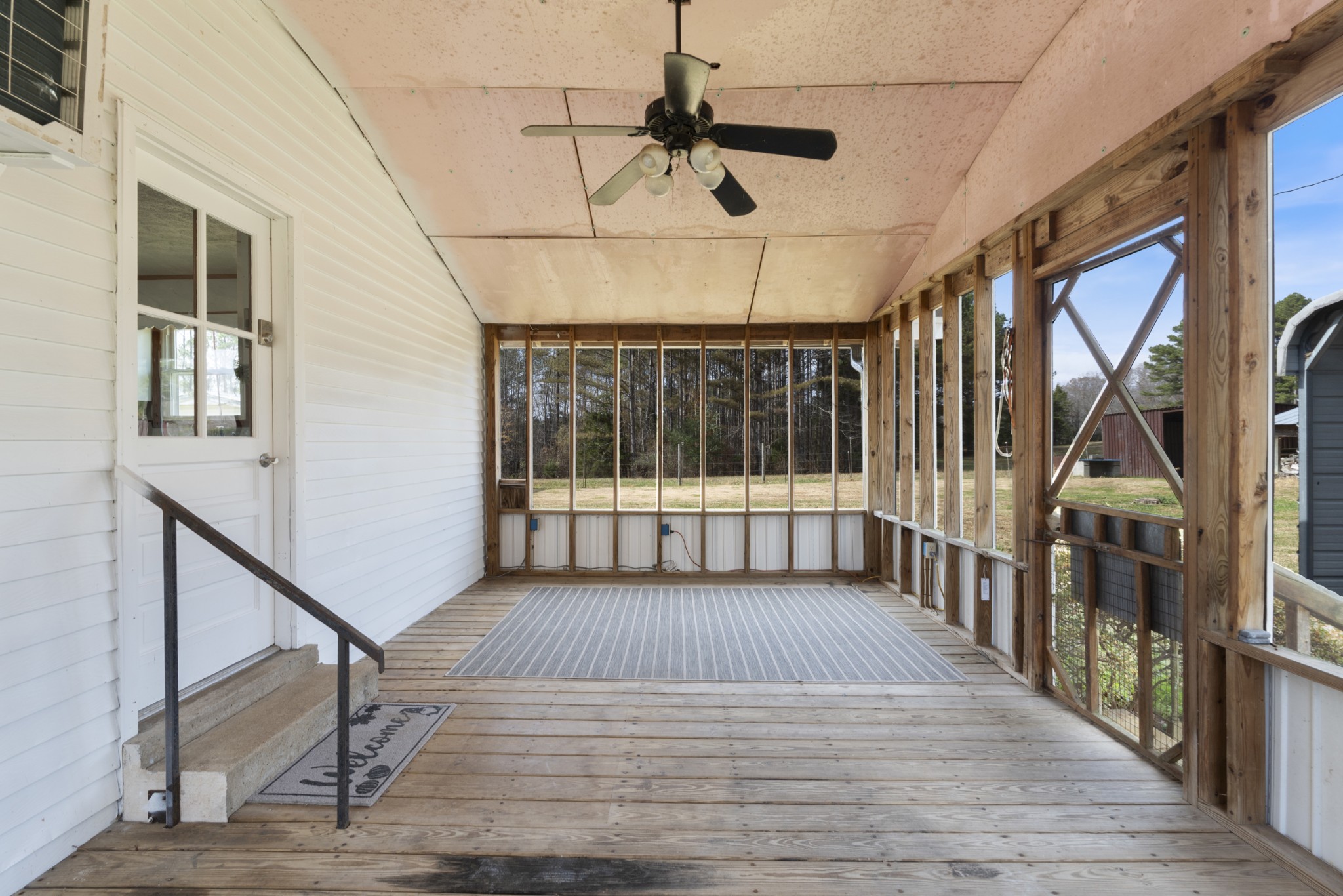7139 Anderson Road Fairview, TN 37062 - Photo 13 of 26 a view of staircase with lots of frames on wall and wooden floor