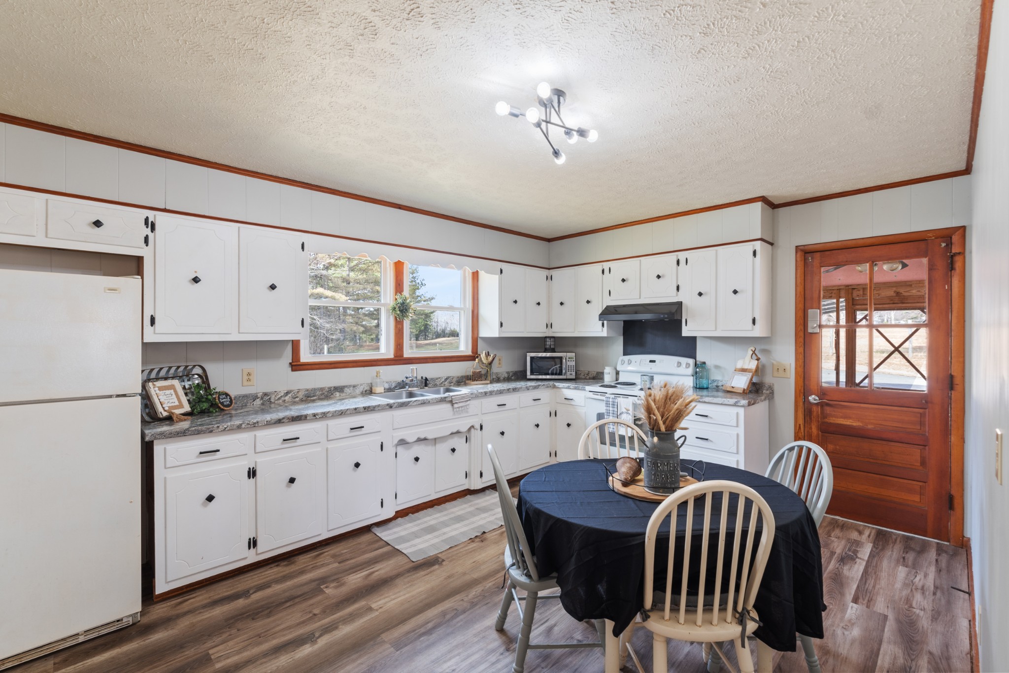 7139 Anderson Road Fairview, TN 37062 - Photo 5 of 26 a kitchen with granite countertop a sink appliances cabinets and furniture