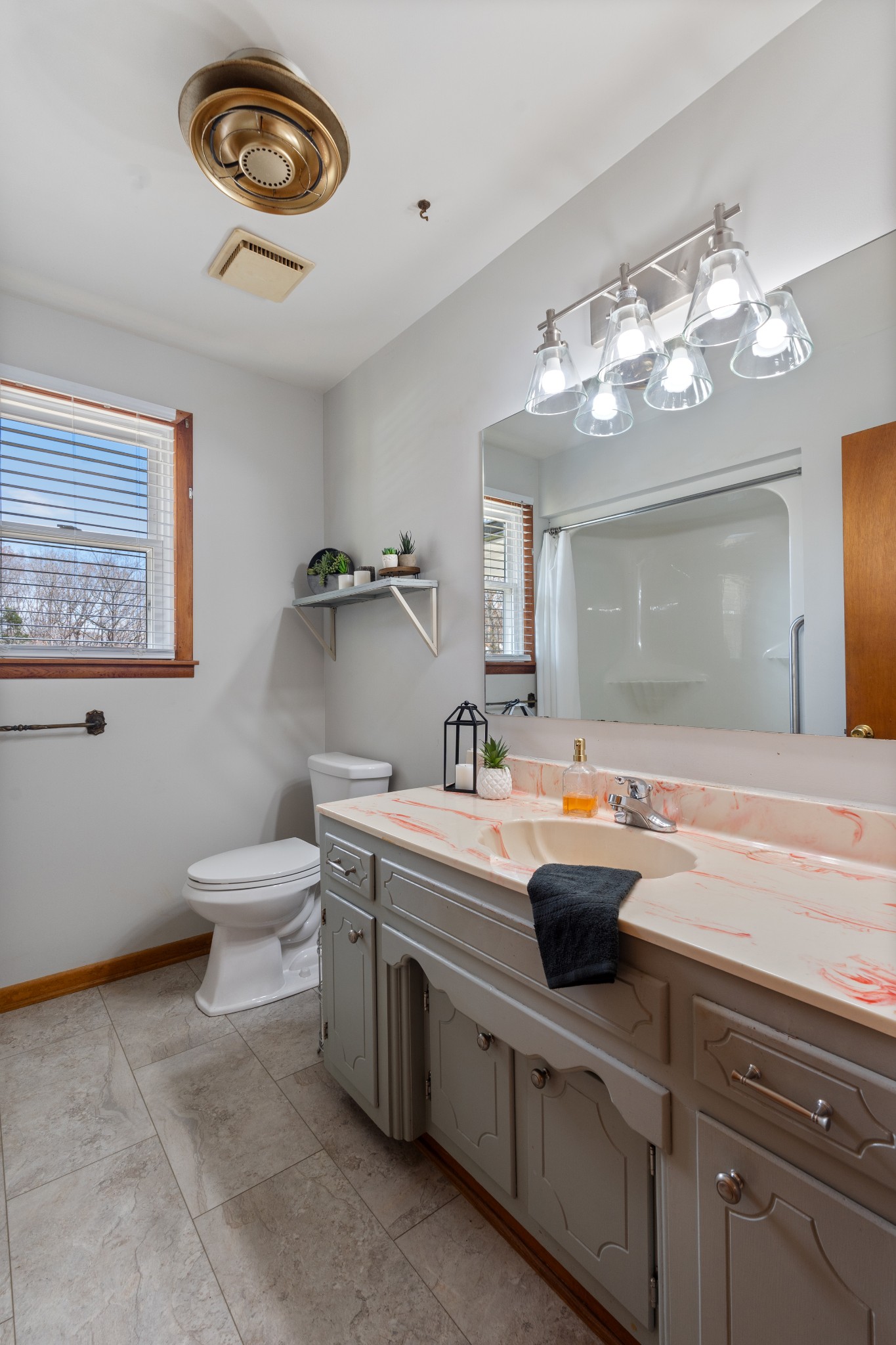7139 Anderson Road Fairview, TN 37062 - Photo 8 of 26 a bathroom with a sink a toilet and a mirror