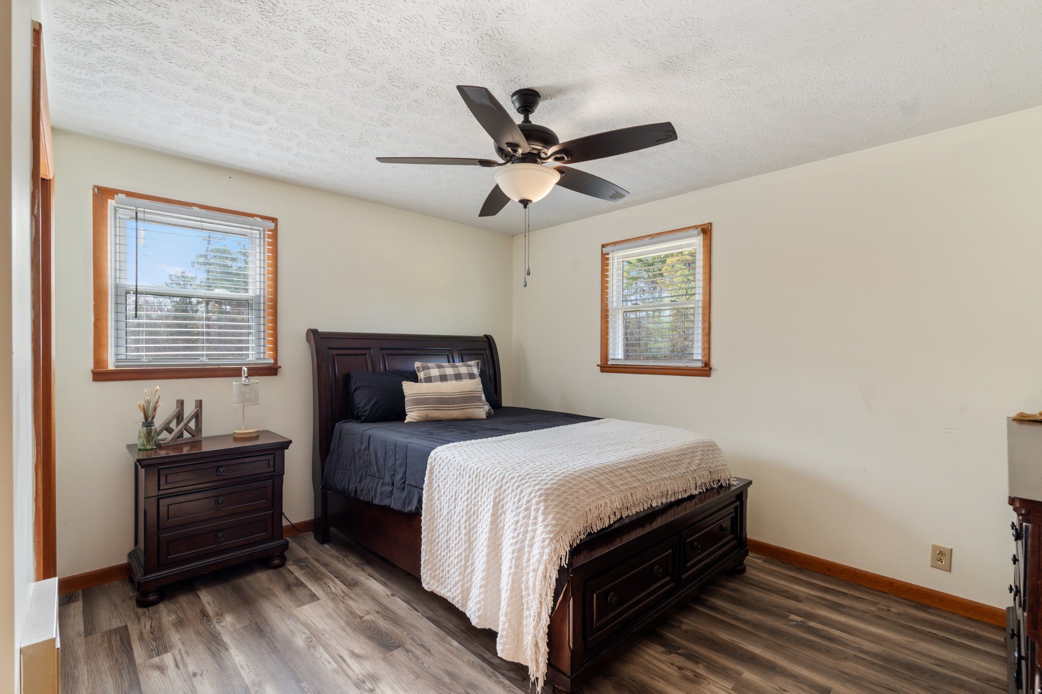 7139 Anderson Road Fairview, TN 37062 - Photo 10 of 26 a bedroom with a bed and wooden floor