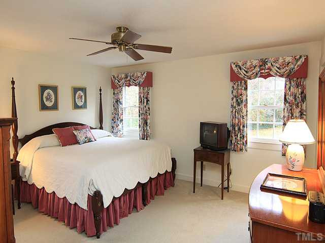 5100 Rembert Drive Raleigh, NC 27612 - Photo 8 of 16 The master bedroom is located on the back left corner of the house & easily accommodates an king sized bed. The master bath, while small, has a long vanity & spacious walk-in shower. Hardwood floors are under the carpet. Master Bedroom