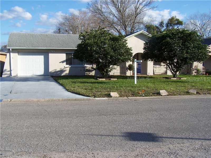 7024 Carmel Avenue New Port Richey, FL 34655 - Photo 1 of 1 Exterior Front - Newer roof, windows & AC