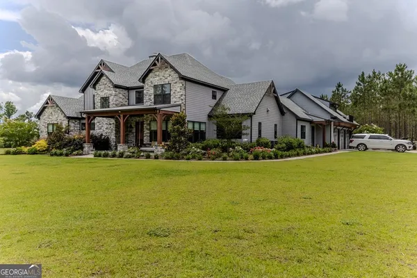 a front view of a house with a yard