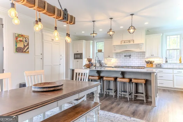 a workspace with wooden floor and a window