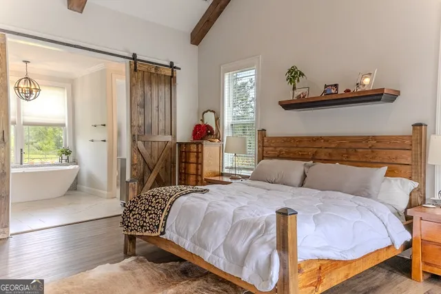 a bedroom with a bed and a couch