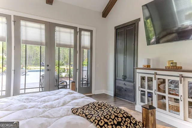 a bathroom with a granite countertop toilet sink and mirror