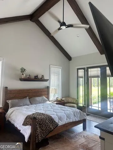 a bathroom with a granite countertop toilet a sink and a mirror
