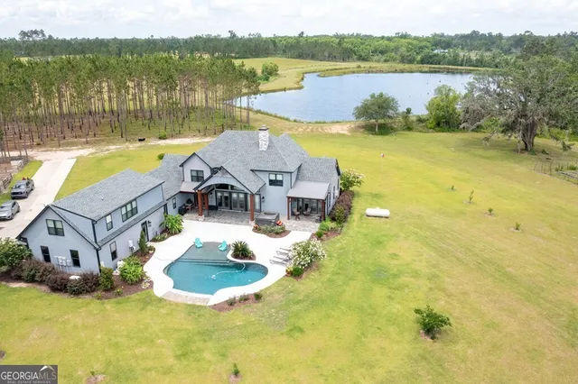 a view of a lake with houses in the background