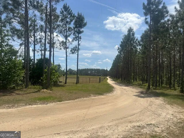 an aerial view of residential houses with outdoor space and river