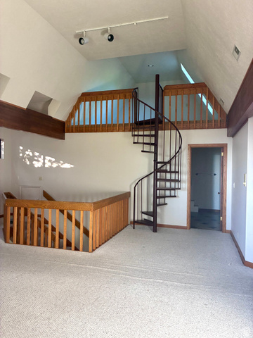 1903 Ridgehollow Drive Bountiful, UT 84010 - Photo 11 of 24 Interior space featuring a spiral staircase, vaulted ceiling, and track lighting
