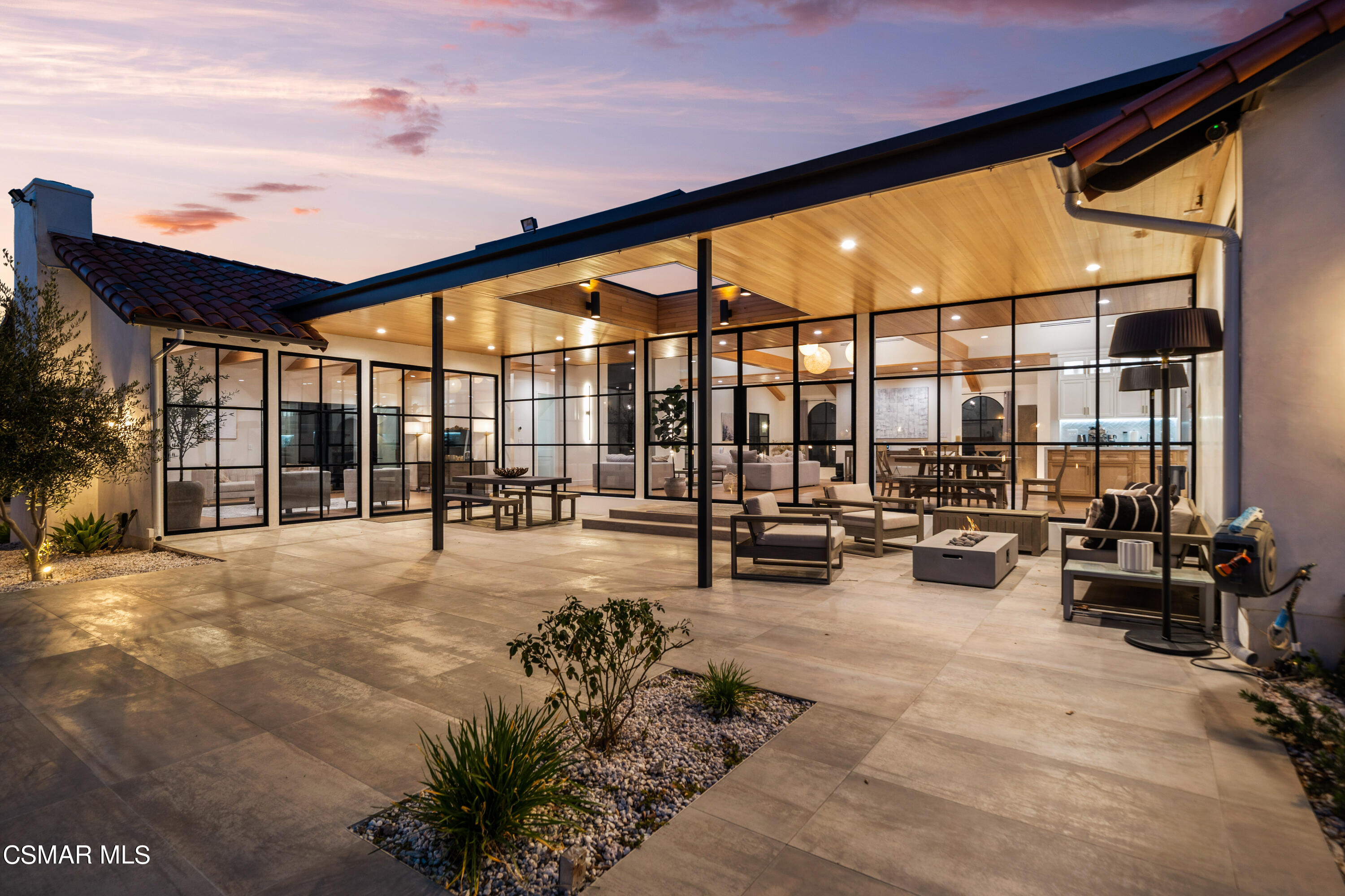 a lobby with furniture and floor to ceiling window