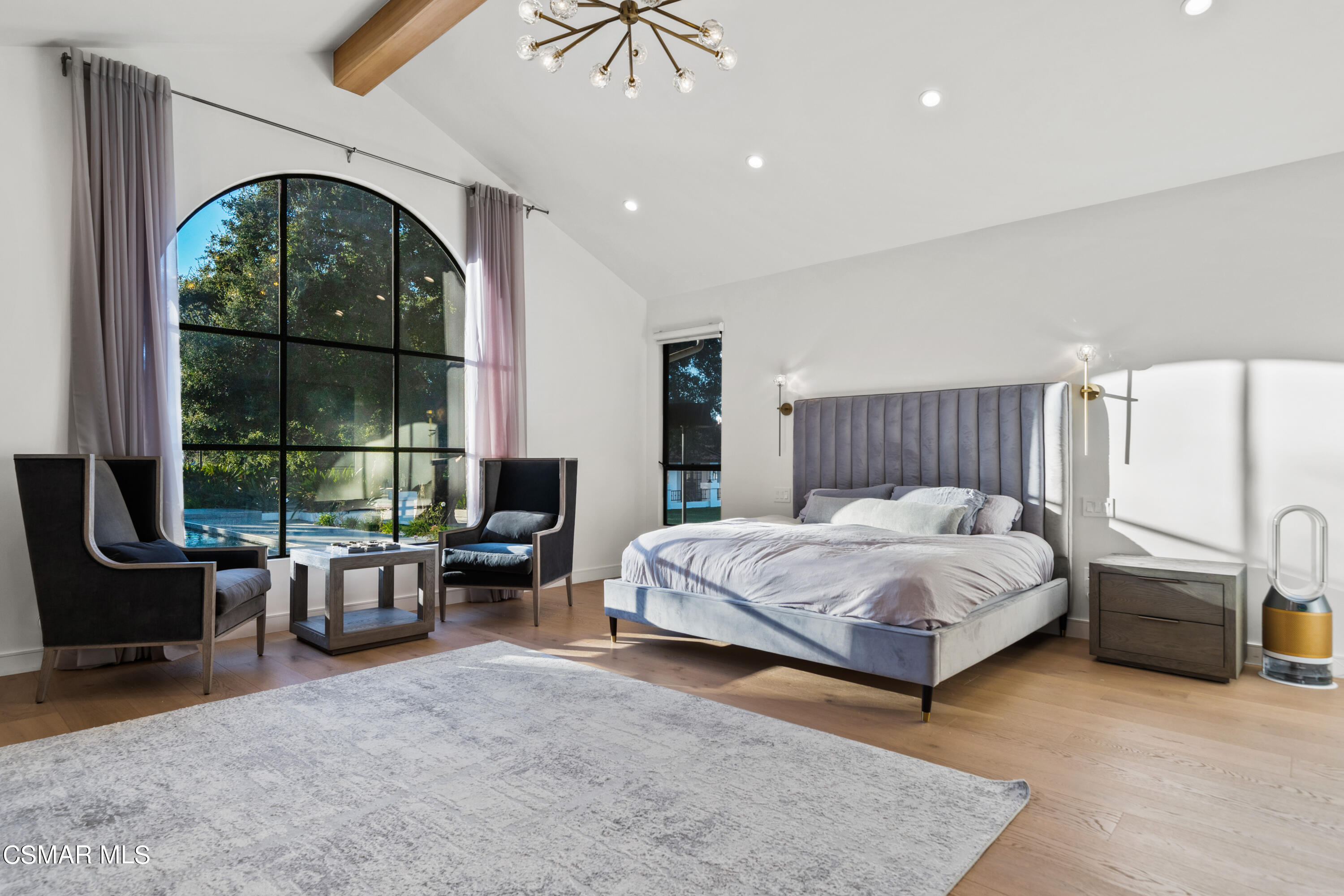 26205 Sand Canyon Road Canyon Country, CA 91387 - Photo 42 of 99 a spacious bedroom with a balcony a bed a table and chairs