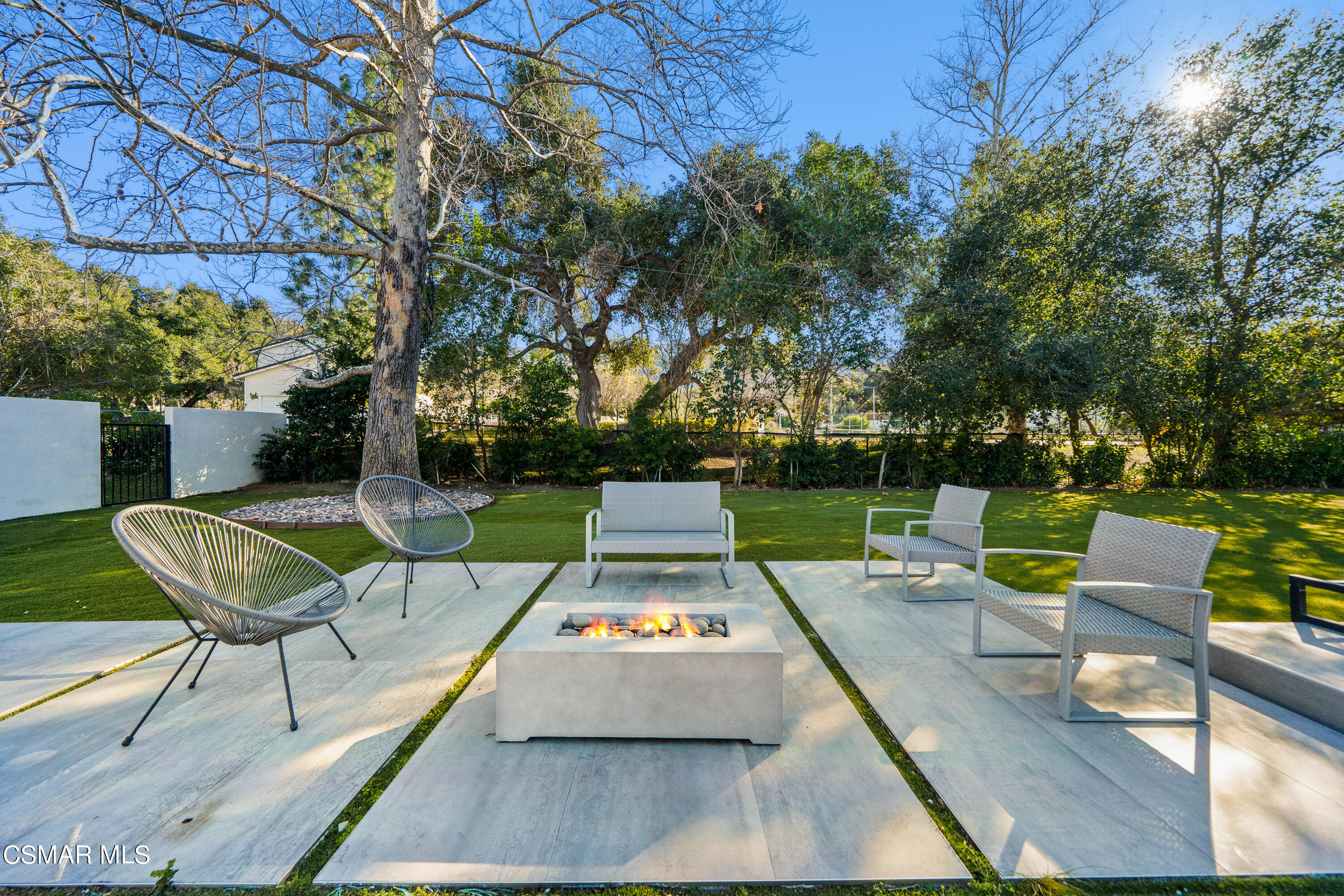 26205 Sand Canyon Road Canyon Country, CA 91387 - Photo 59 of 99 a view of a patio with couches table and chairs with wooden floor and fence