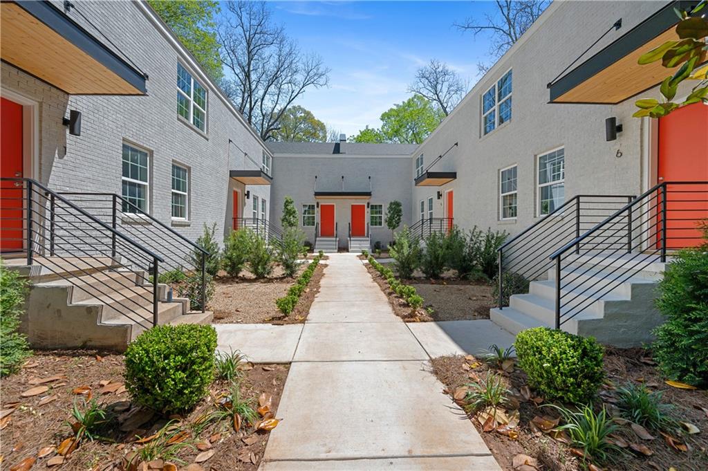237 Howard Street Northeast, Unit 3 Atlanta, GA 30317 - Photo 1 of 18 a view of a pathway with a house