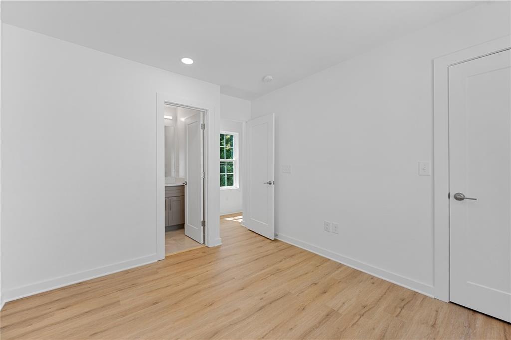 237 Howard Street Northeast, Unit 3 Atlanta, GA 30317 - Photo 15 of 18 a view of an empty room with wooden floor