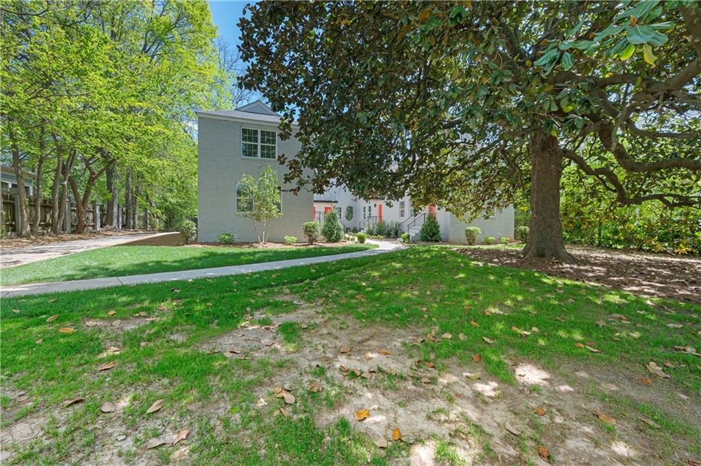 237 Howard Street Northeast, Unit 3 Atlanta, GA 30317 - Photo 17 of 18 a backyard of a house with lots of green space
