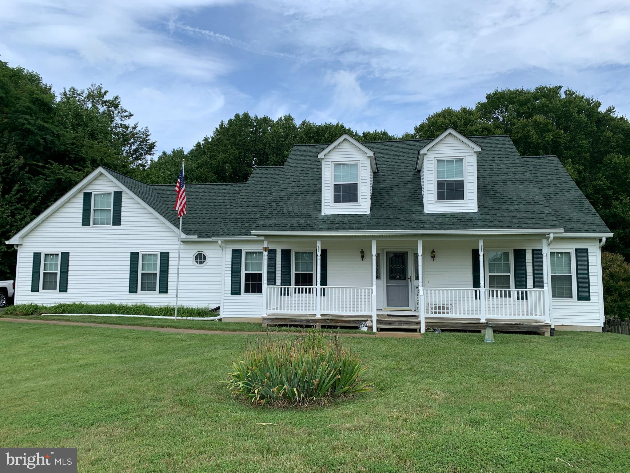 4650 Paul Hance Road Huntingtown, MD 20639 - Photo 1 of 57 a front view of a house with a yard