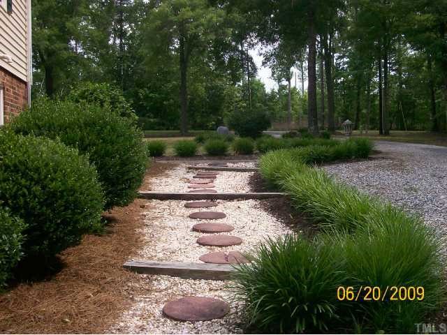 5031 Preacher Holmes Road Graham, NC 27253 - Photo 3 of 12 Lush Walkway from Back Yard