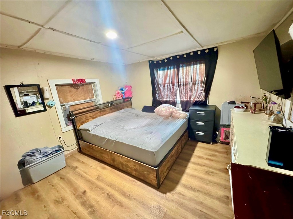 306 13th Street Southeast Immokalee, FL 34142 - Photo 11 of 11 a bed room with a bed window and a flat screen tv