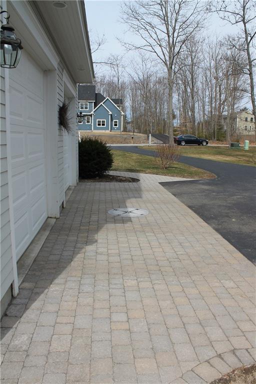 4 Freedom Road Scarborough, ME 04074 - Photo 5 of 33 Custom stone work in front of garage bay