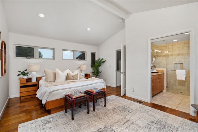 a bedroom with a bed and a table