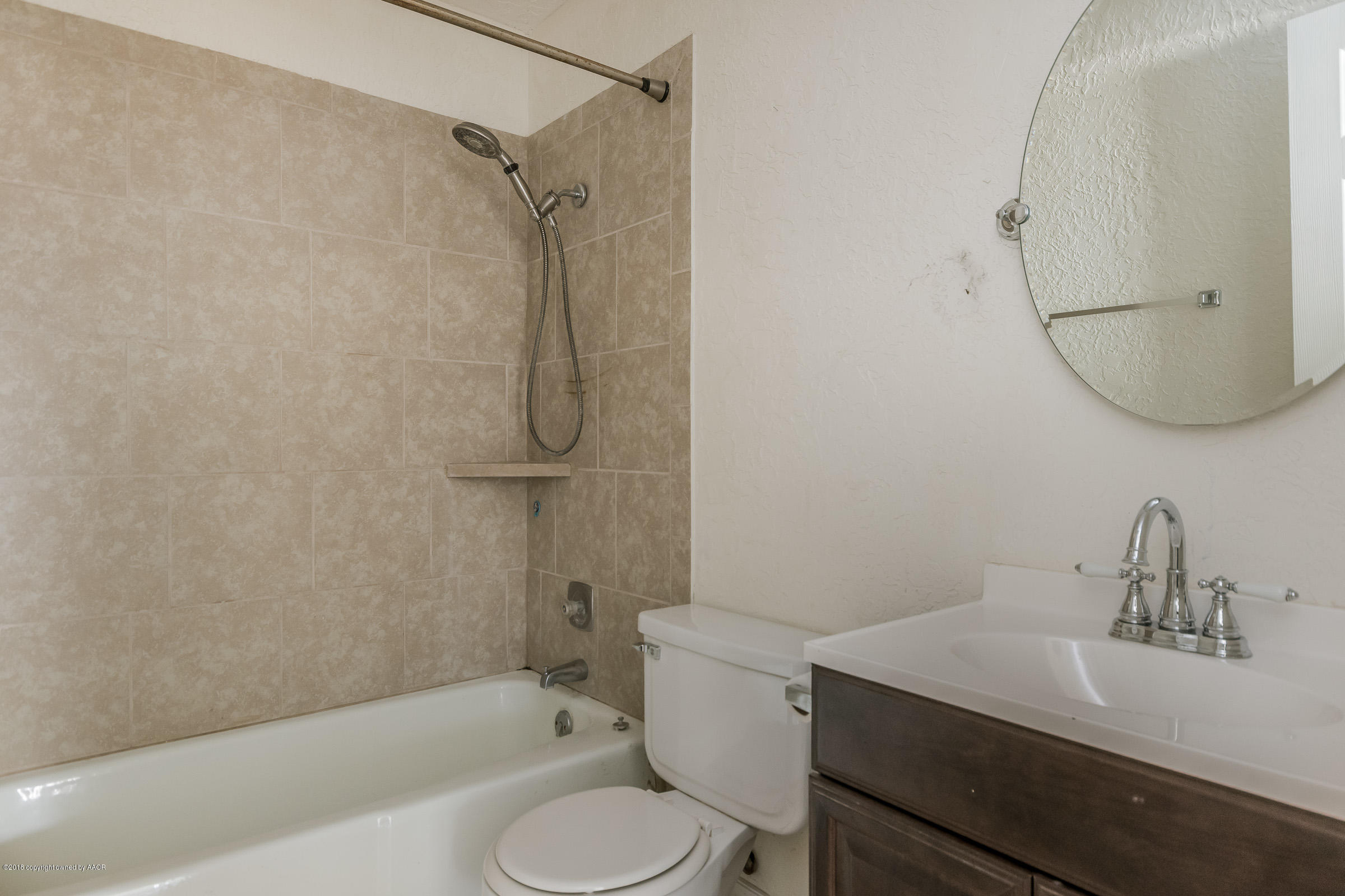 5340 Whitney Lane Amarillo, TX 79110 - Photo 11 of 14 a bathroom with a sink toilet and shower