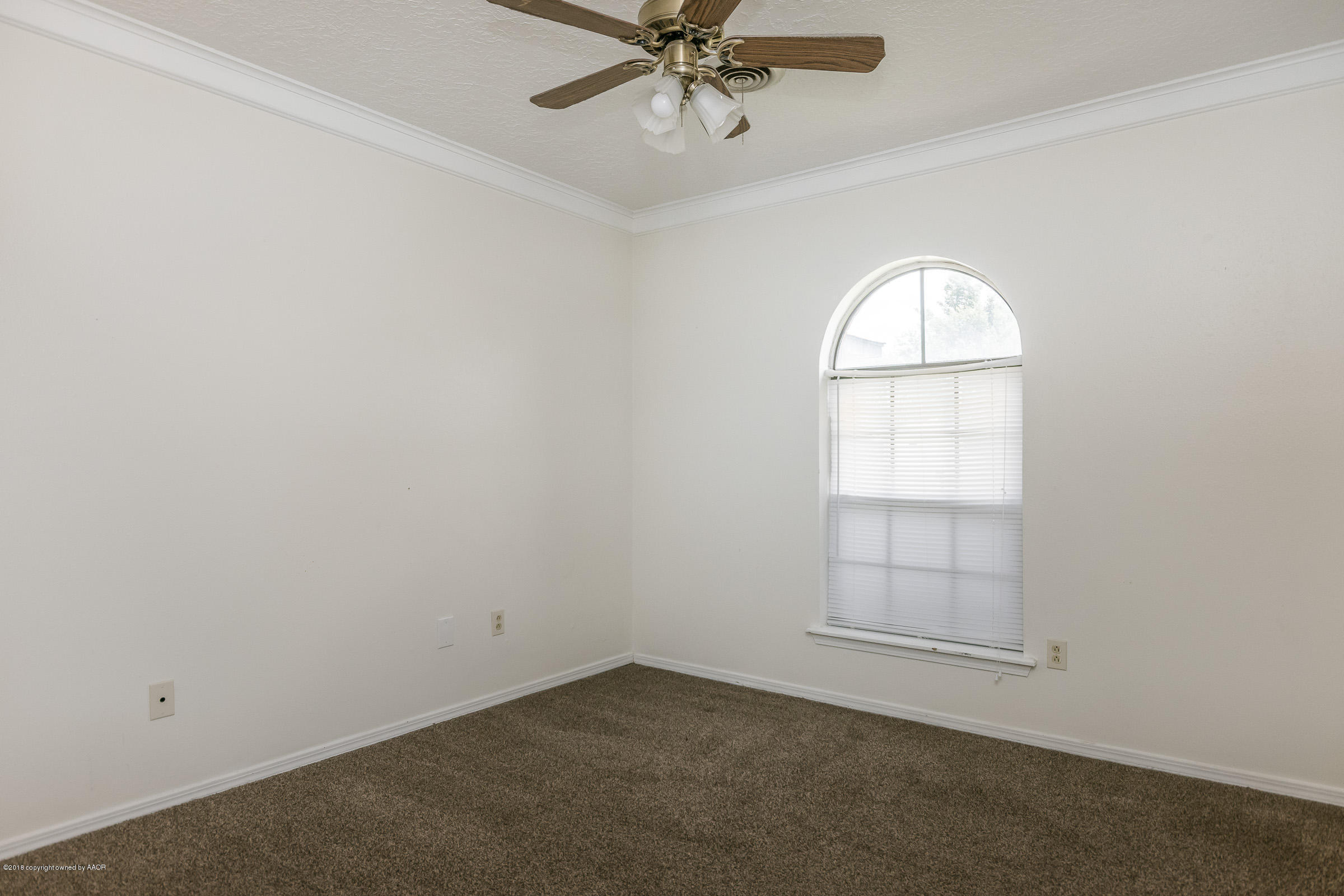 5340 Whitney Lane Amarillo, TX 79110 - Photo 12 of 14 an empty room with windows and fan