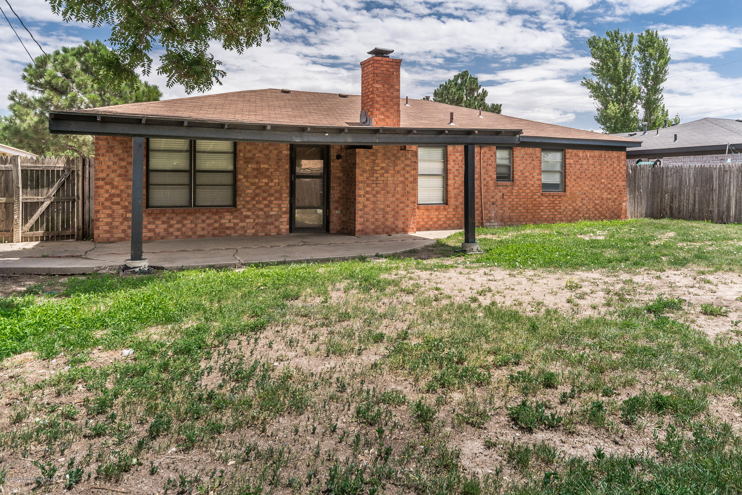 5340 Whitney Lane Amarillo, TX 79110 - Photo 14 of 14 a front view of a house with garden