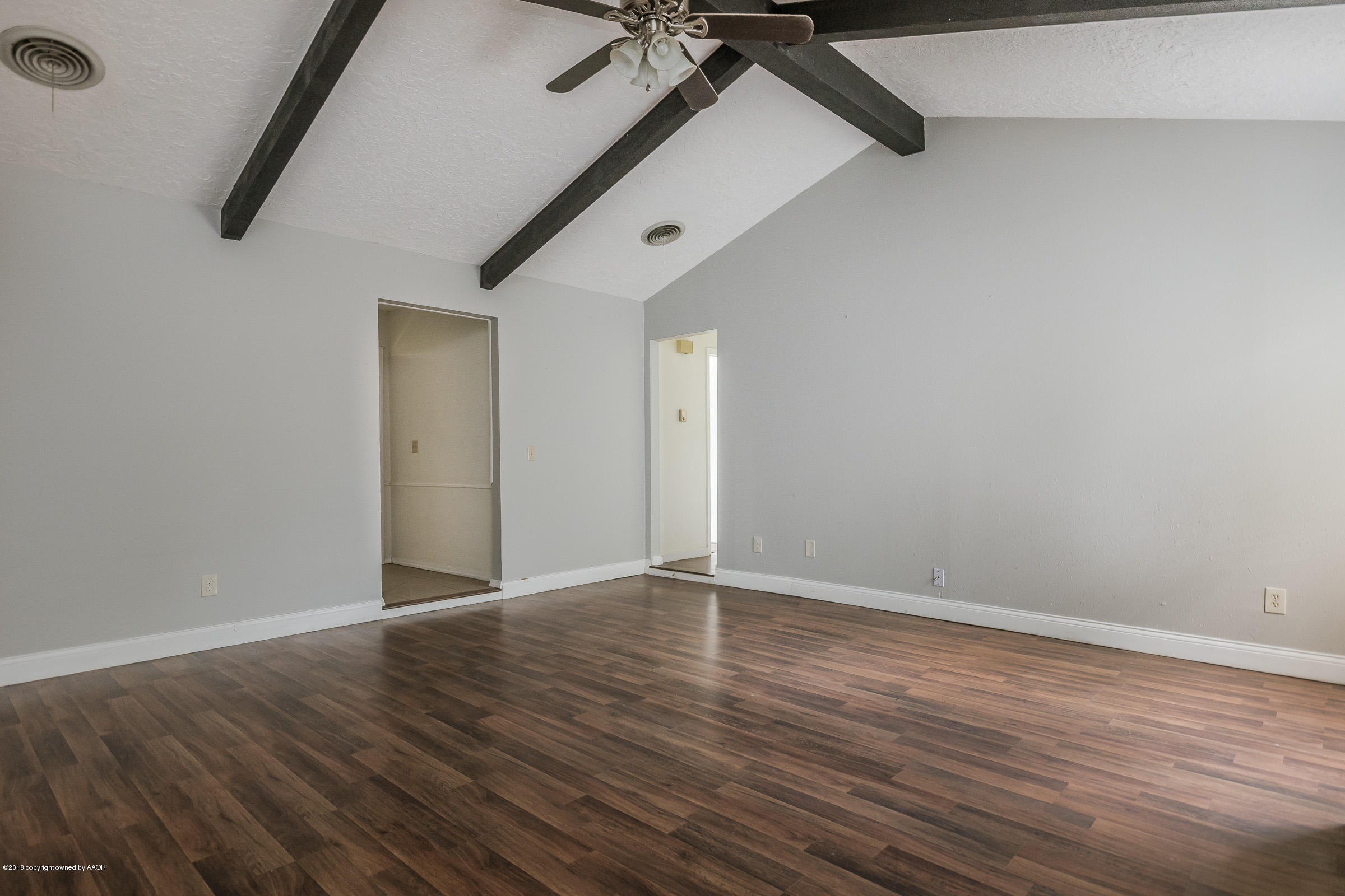 5340 Whitney Lane Amarillo, TX 79110 - Photo 4 of 14 a view of an empty room with wooden floor
